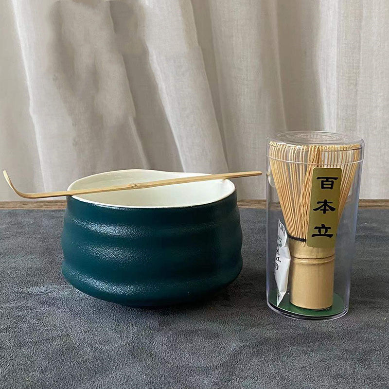 Gaolan Matcha Tea Set — Dark green matte matcha bowl with a whisk and scoop.