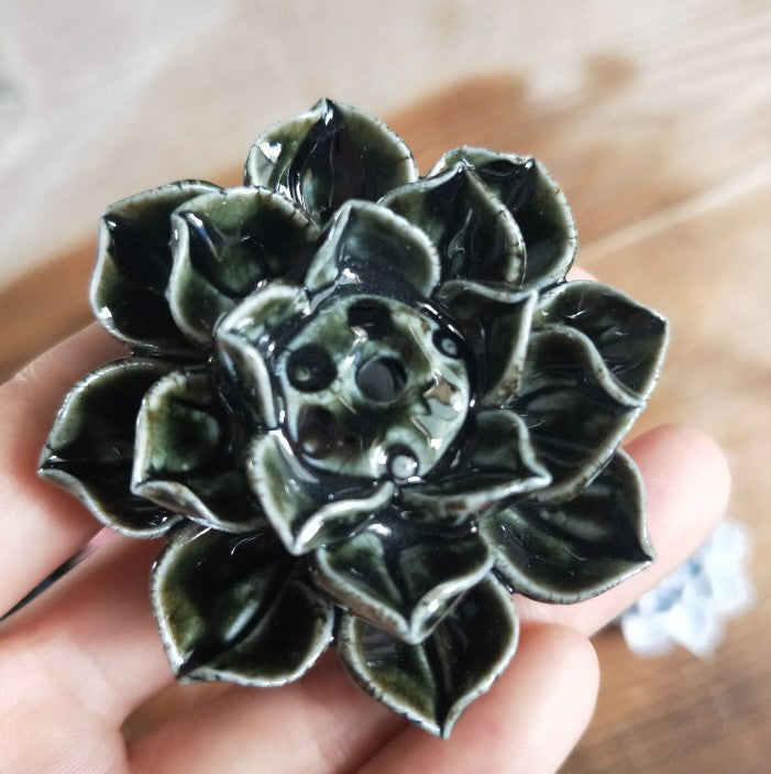 Lombok Incense Holder — Dark lotus-shaped ceramic incense holder.