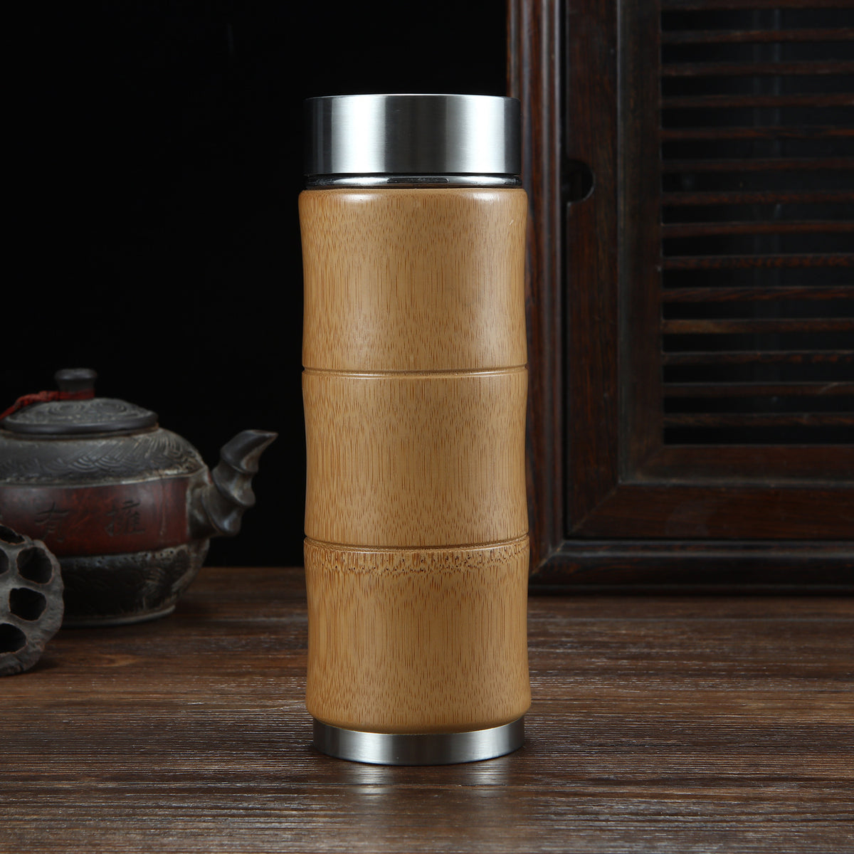 Yueyun Bamboo Travel Cup — Three-section bamboo travel cup with a stainless-steel interior.