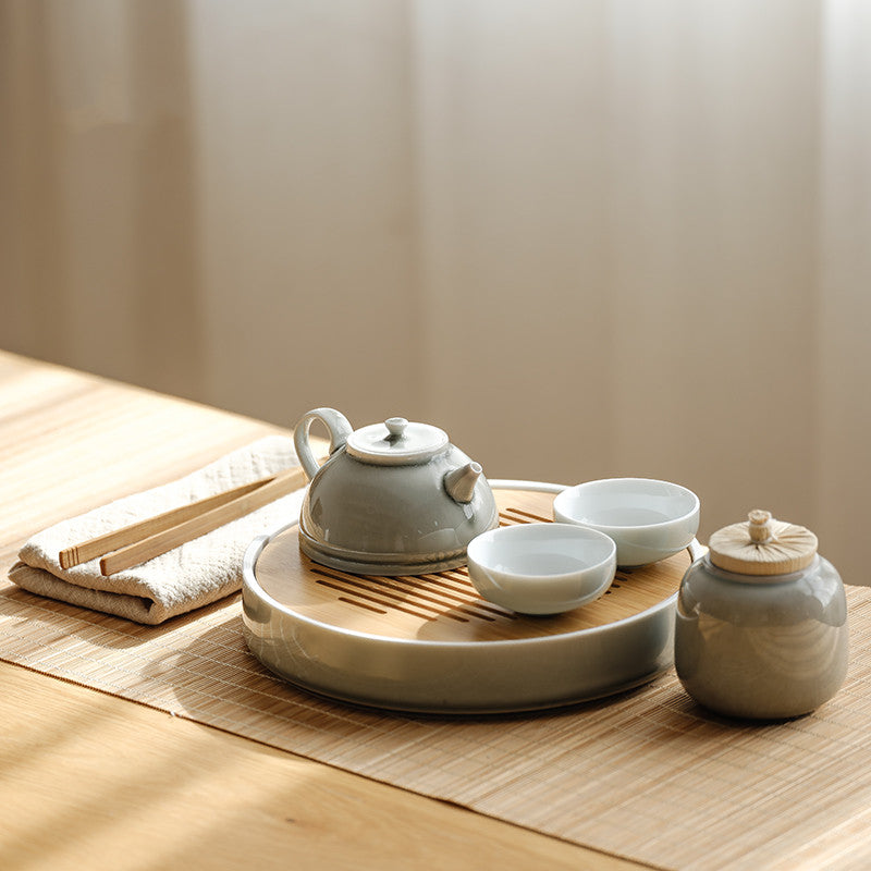 Sakura Ceramic Tea Set — Pale porcelain tea service with a round ceramic tray.