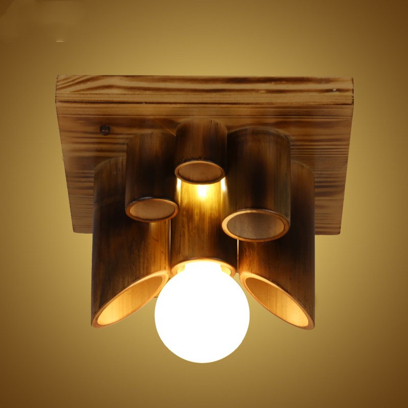 Moxiang Wooden Ceiling Light — Wooden ceiling fixture with three tubular shades.