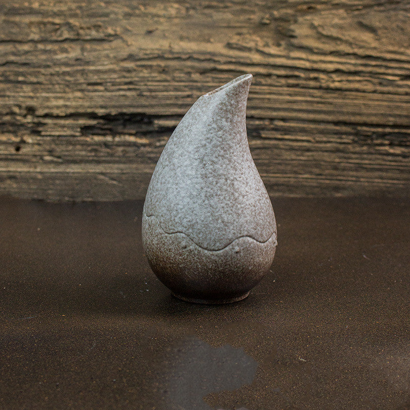 Isahaya Droplet Vase — White textured teardrop-shaped ceramic vase.