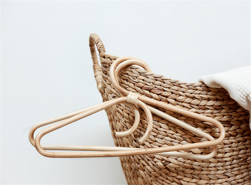 Changle Rattan Hanger — Single-hook adult hanger in a natural finish.