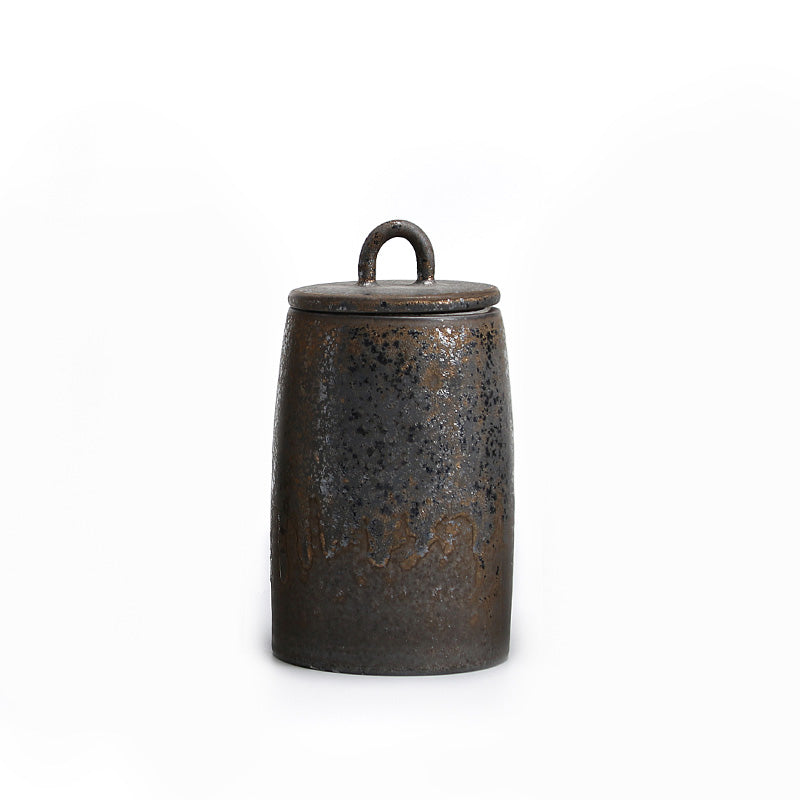 Lingga Tea Caddy — Tall ceramic tea caddy with a lidded top and loop handle.