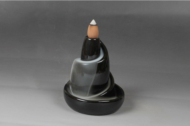 Ninglan Incense Burner — Black spiral-shaped ceramic backflow incense holder.