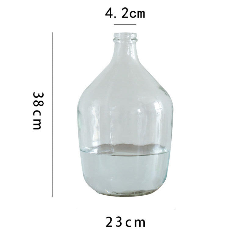 Lianhua Vase — Clear bottle-shaped glass vase.