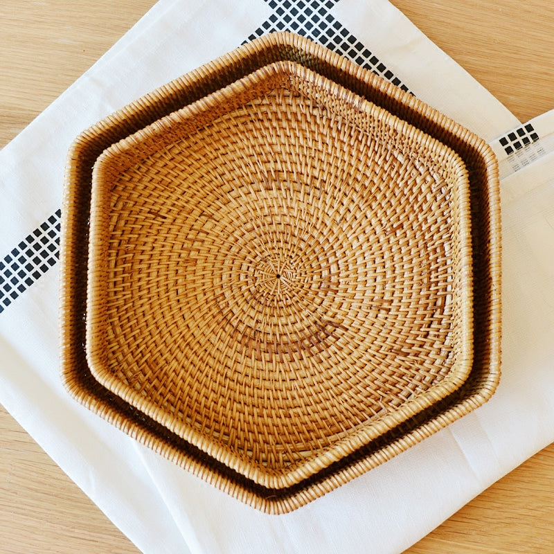 Anji Storage Basket — Hexagonal basket in a brown woven finish.