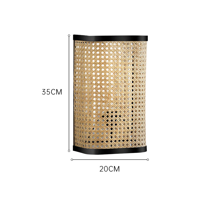 Haru Rattan Wall Lamp — Rounded rectangular rattan wall light with dark trim.