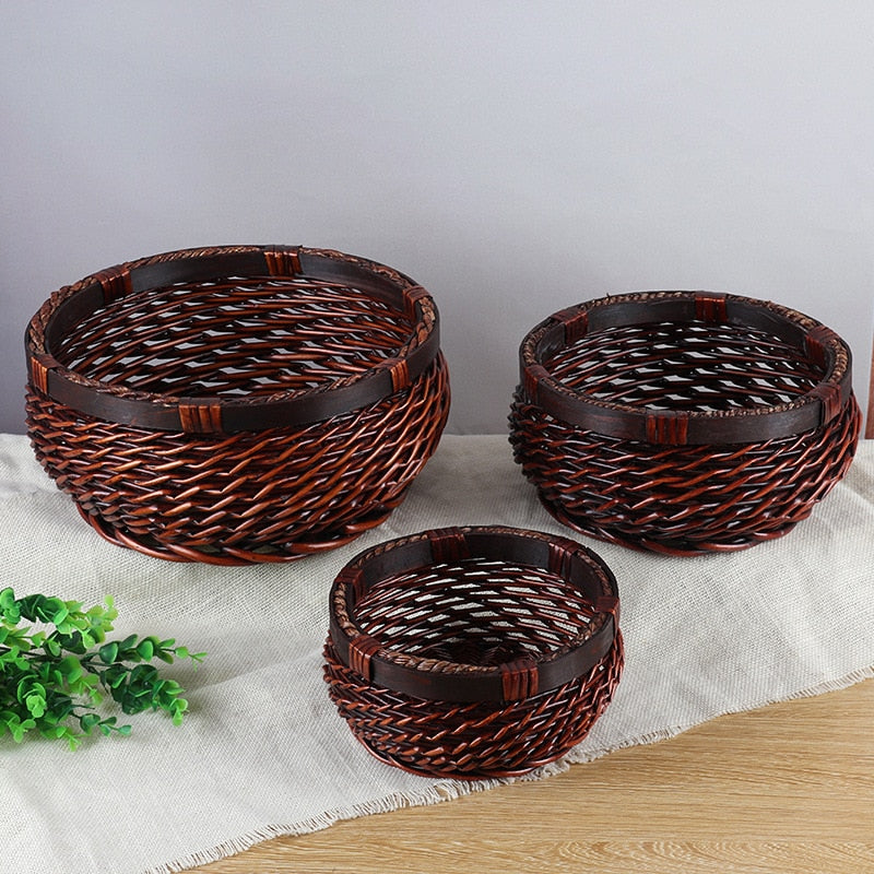 Uluwatu Storage Basket — Set of three round baskets in a dark woven finish.