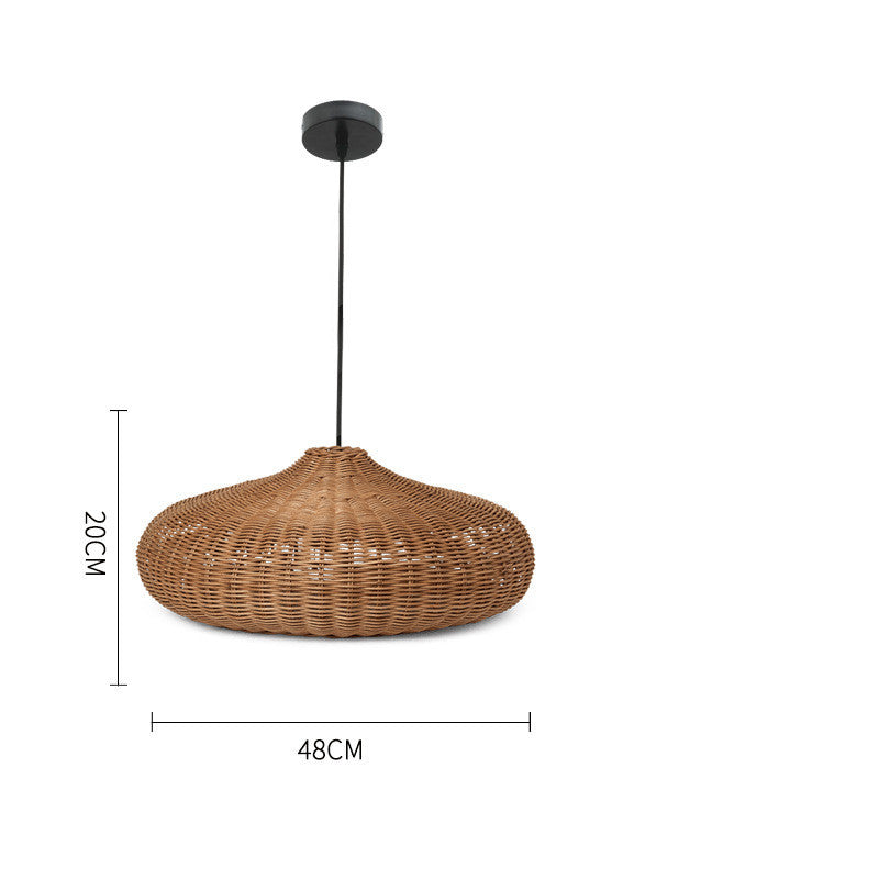 Cendana Rattan Pendant Light — Wide, shallow woven pendant shade.