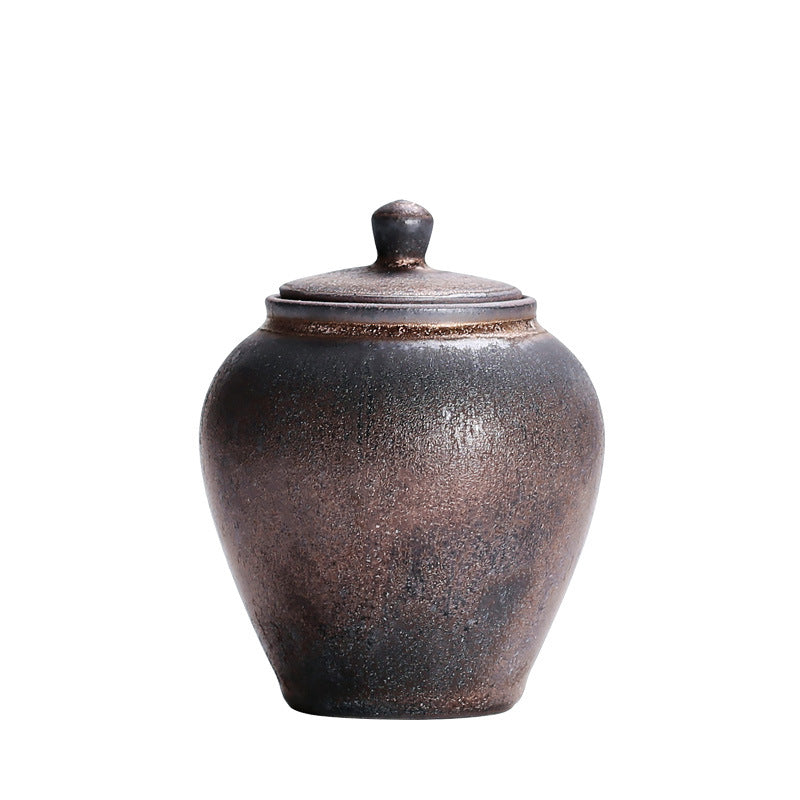 Ohara Tea Caddy — Rounded ceramic tea caddy with a lid.