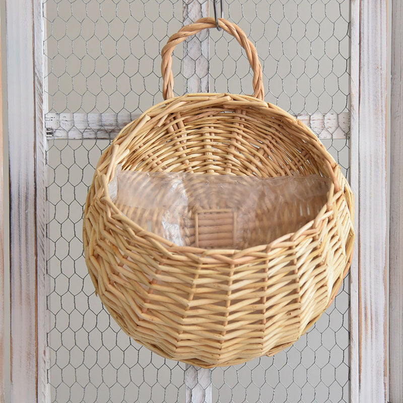 Fujino Storage Basket — Round woven wall basket with a top handle.