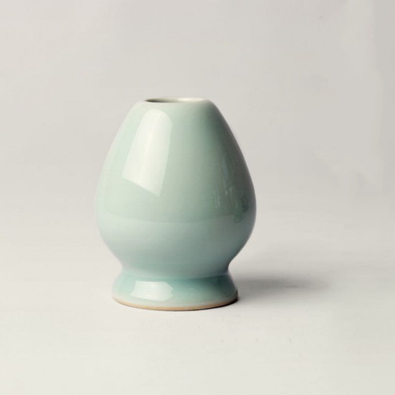 Wenyue Matcha Whisk Stand — Single celadon-coloured ceramic whisk rest.