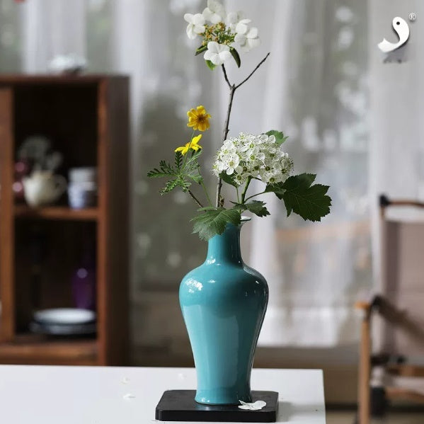 Nirwana Ceramic Vase — Azure ceramic vase with a narrow neck and classical profile.