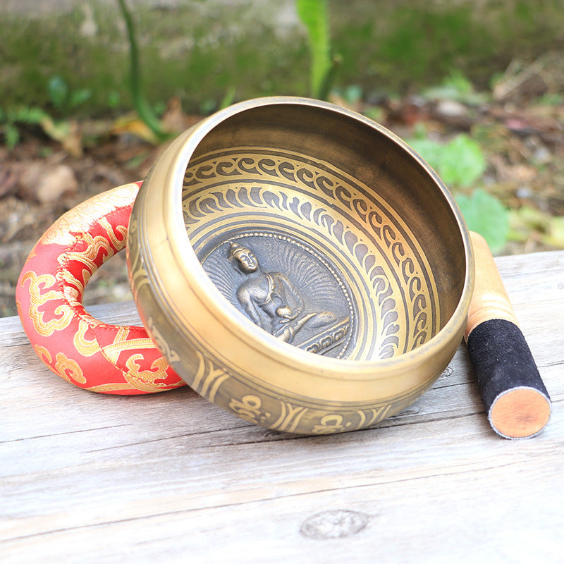 Huaqing Singing Bowl — Copper singing bowl with the Shakyamuni motif.