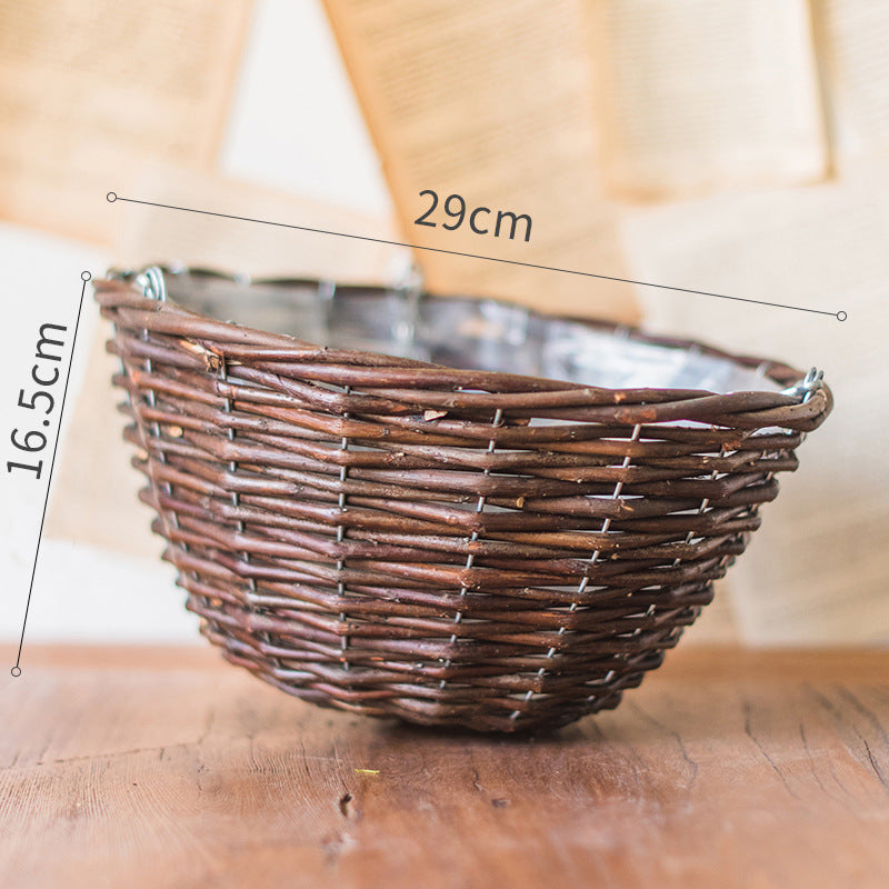 Komodo Storage Basket — Woven hanging basket with an open upper section.