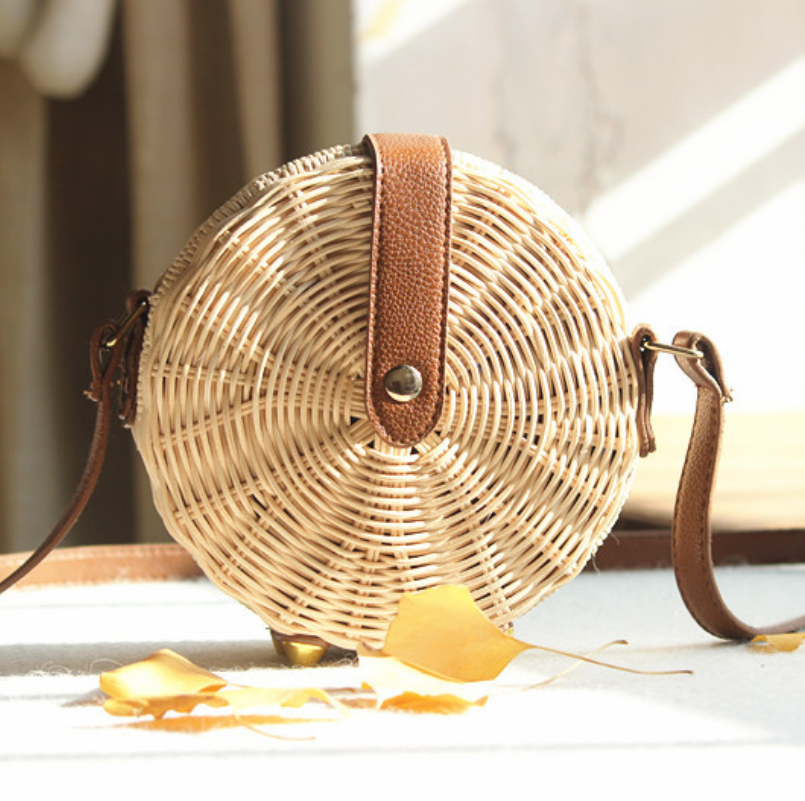 Mamuju Woven Handbag — Round radial woven handbag with a shoulder strap.