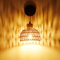 Ganzhou Wall Light — Woven bell-shaped wall-light shade on a dark mounting arm.