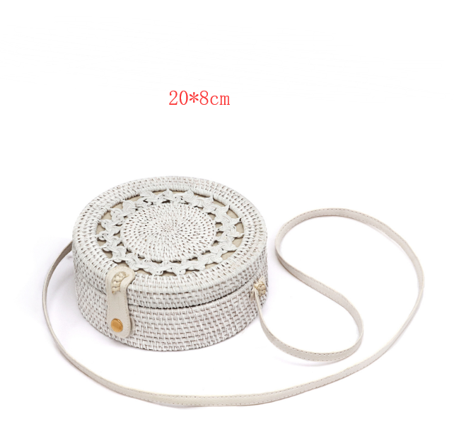 Amano Woven Crossbody Bag — Round white woven crossbody bag.