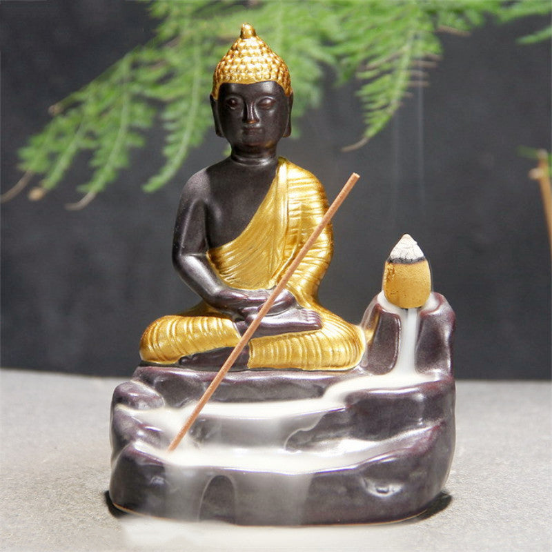 Xinyun Buddha Incense Burner — Gold-toned seated Buddha ceramic backflow incense holder.