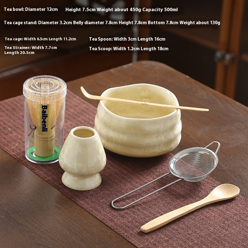 Hikone Matcha Tea Set — Pale yellow matcha bowl with a wavy rim and preparation tools.