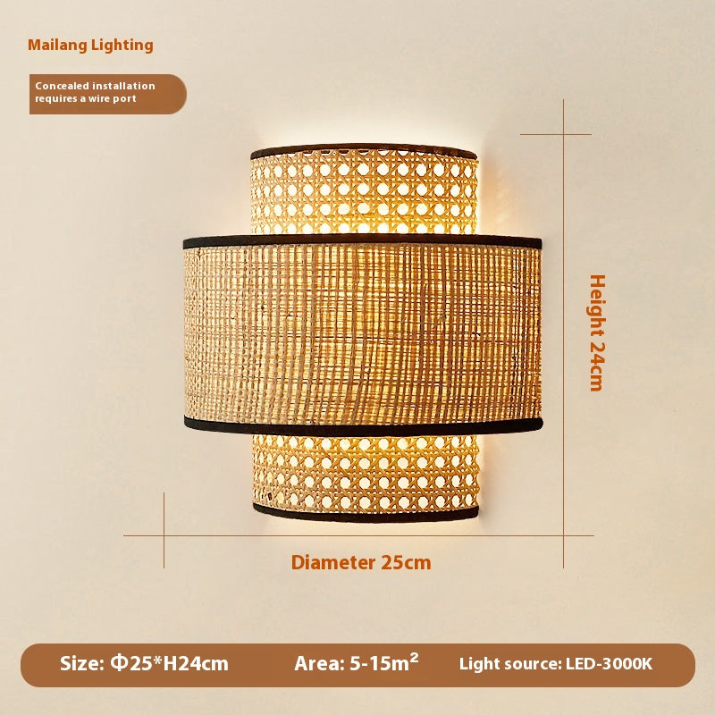 Ruolan Rattan Wall Lamp — Wall light with a layered cylindrical woven shade.