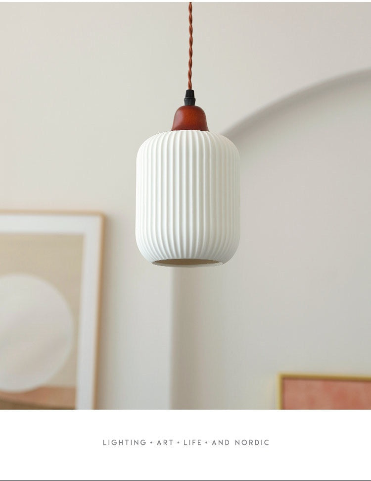 Mojokerto Pendant Light — Short lantern-shaped pendant with a pale ribbed shade.