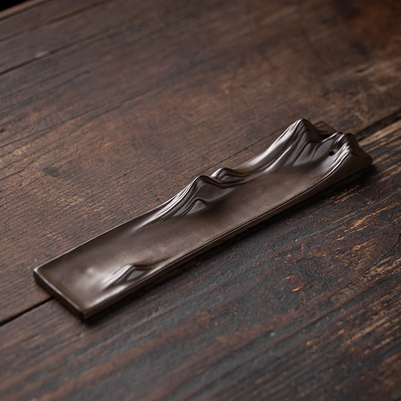 Iwakuni Incense Holder — Brown folded-leaf ceramic incense plate.