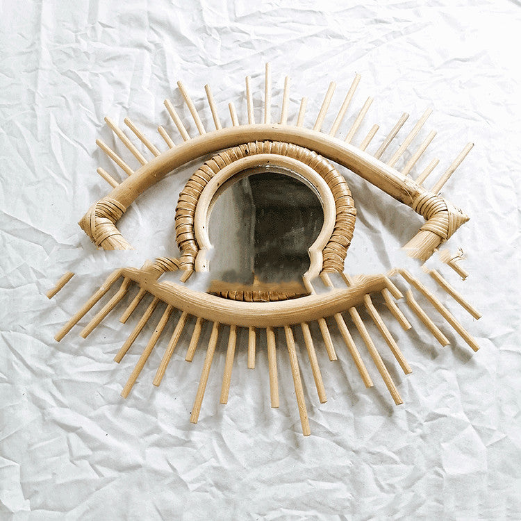 Dongting Wall Mirror — Eye-shaped rattan frame supplied with mirror glass.