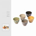 Jernih Tea Cup Set — Set of five tea cups with different glazed finishes.