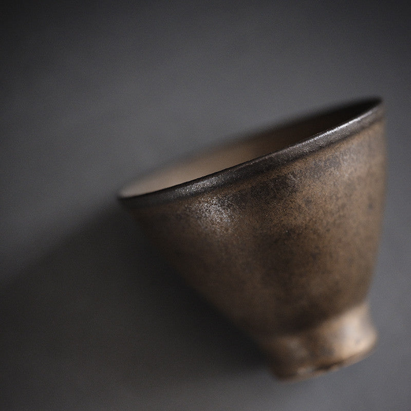 Maizuru Tea Cup — Ceramic tea cup with a patinated glazed finish.