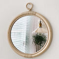 Batam Wall Mirror — Round bamboo-framed wall mirror with a hanging loop.
