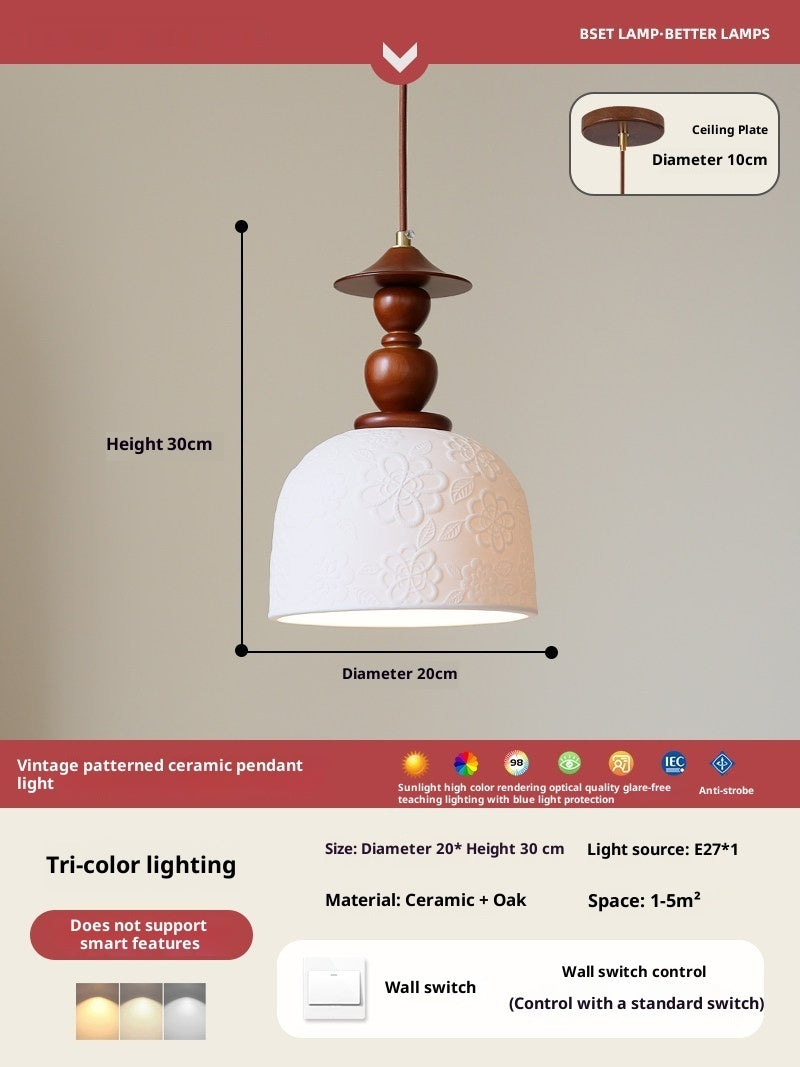 Rona Wood & Ceramic Pendant Light — White ceramic bell shade suspended from a sculptural wooden stem.