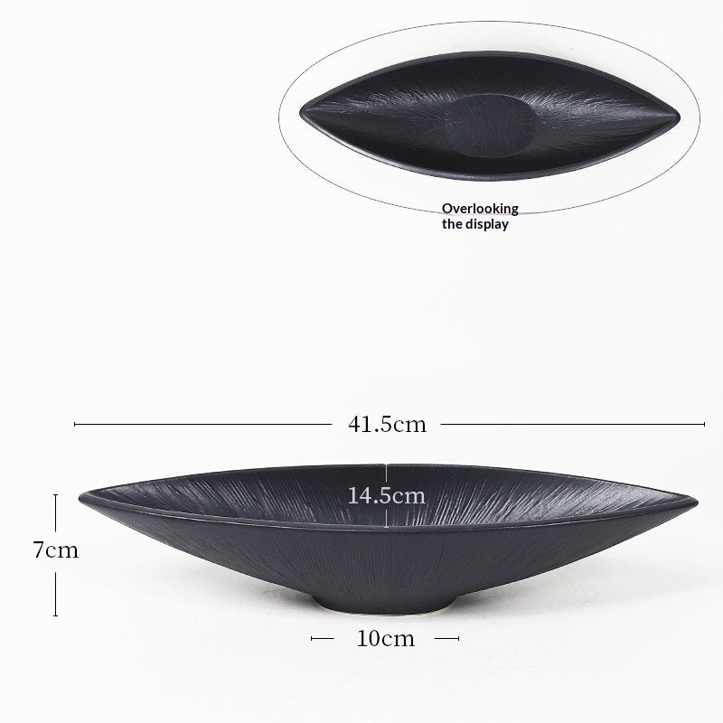 Xiuzhu Ceramic Ikebana Vessel — Black shallow oval ceramic vessel for floral arrangements.