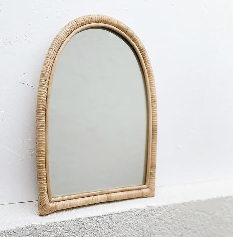 Juwita Rattan Arch Mirror — Tall arched mirror with a woven rattan frame.