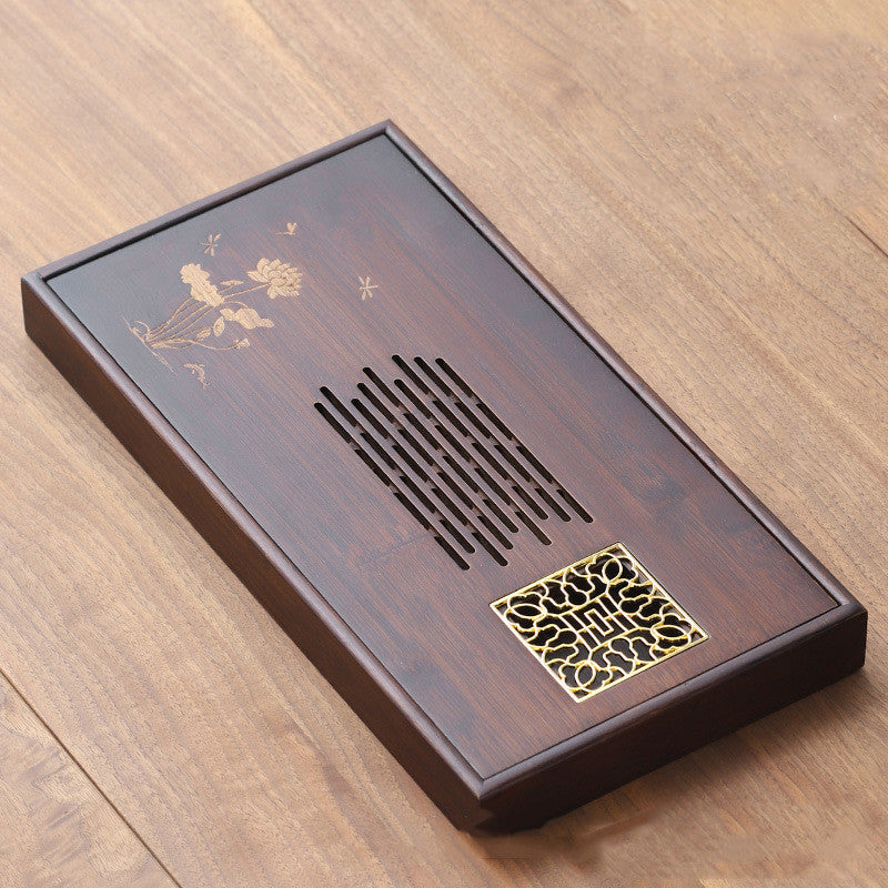 Xiuyue Serving Tray — Rectangular bamboo tea tray with a carved drainage pattern.