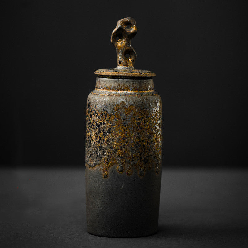 Qingning Tea Caddy — Tall lidded ceramic tea caddy in a golden dark finish.