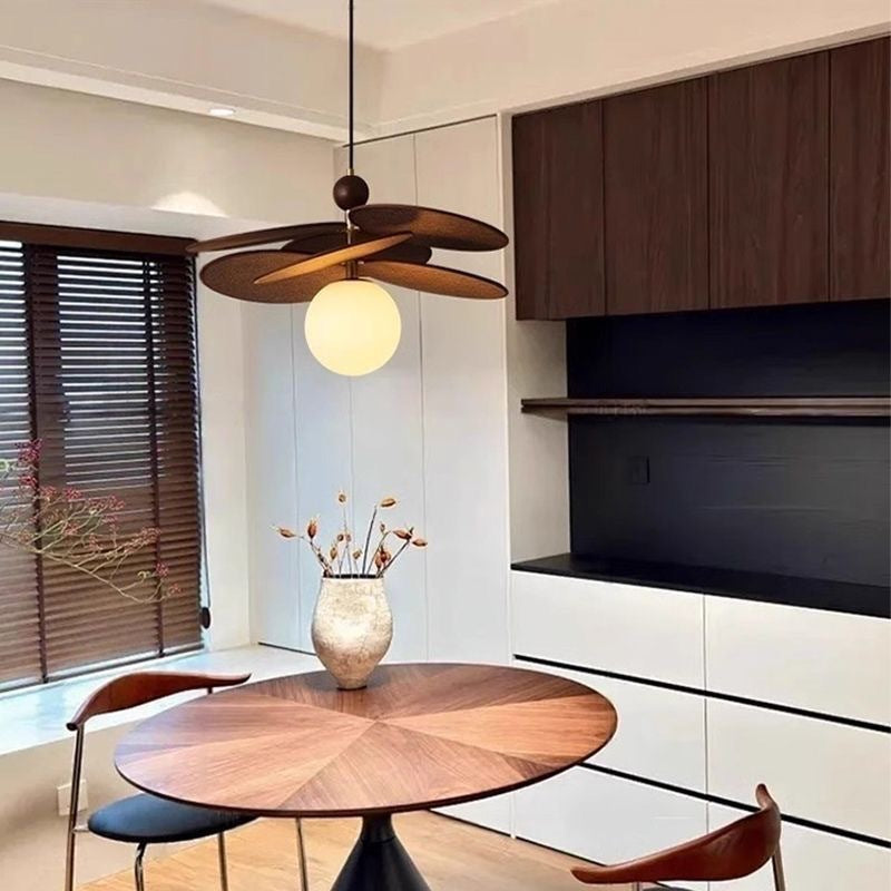 Majalengka Pendant Light — Single-head pendant with petal-shaped wooden elements and a wooden ball.