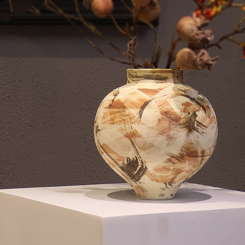 Lianyue Vase — Round ceramic vase with floral decoration.