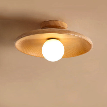 Ina Ceiling Light — Small wooden disc-cap ceiling light with a glass shade.
