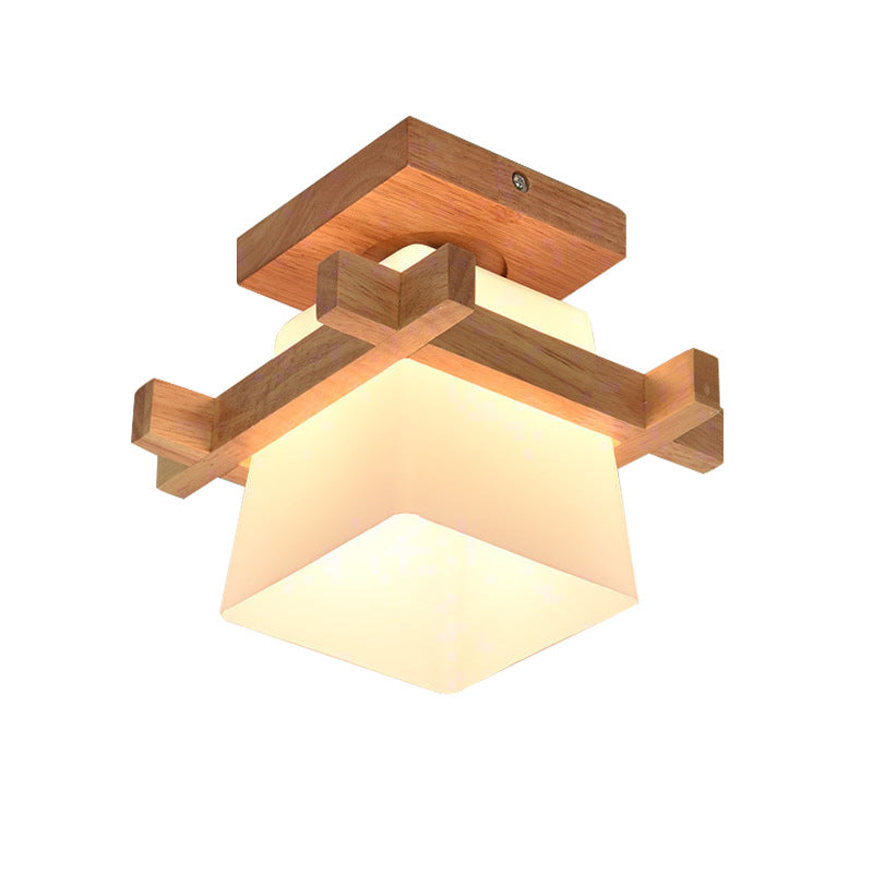 Qingshi Wooden Ceiling Lamp — Wooden cross-frame ceiling fixture with a glass cube shade.