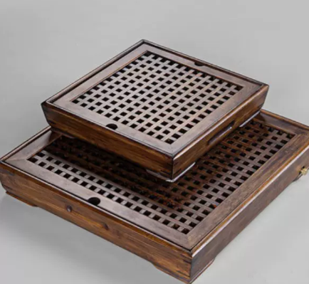 Anhe Serving Tray — Square bamboo tea tray with a perforated surface.