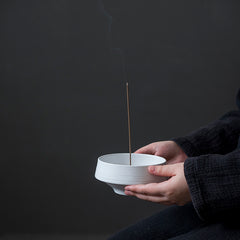 Kudus Incense Holder — White circular ceramic incense holder with an off-centre opening.