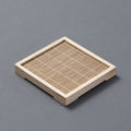 Xinhe Coaster — Square natural-coloured bamboo tea coaster.