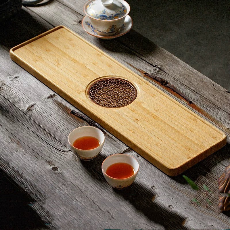 Zhenlan Tea Tray — Rectangular tea tray with a circular drainage pattern.