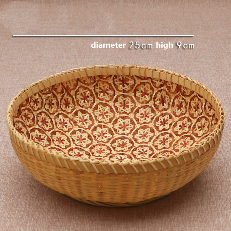 Baihe Storage Basket — Round woven basket with a patterned base.