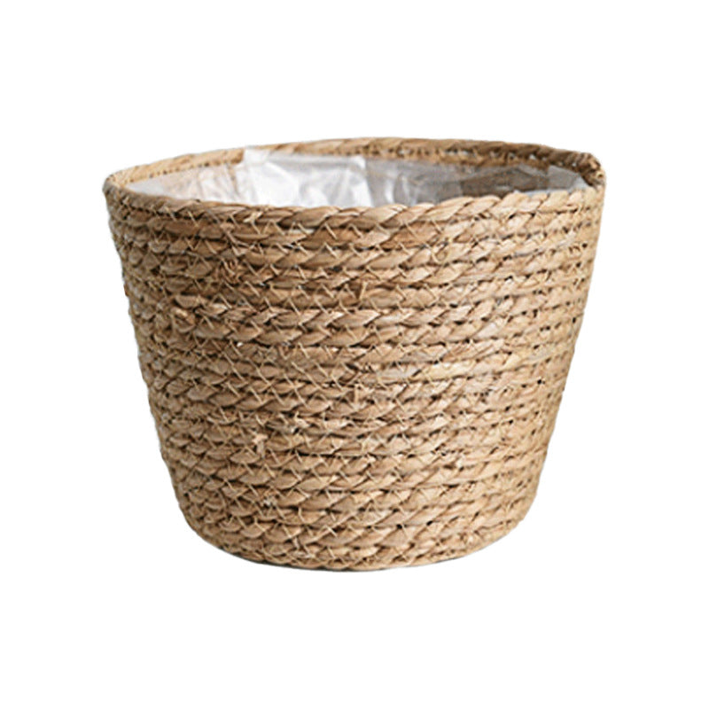 Cianjur Storage Basket — Tapered woven planter basket with an inner liner.