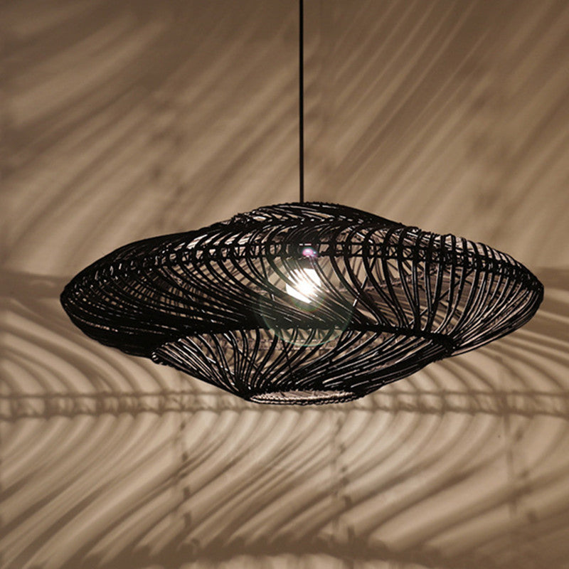 Zhenhua Rattan Pendant Light — Wide, flat black woven pendant shade.