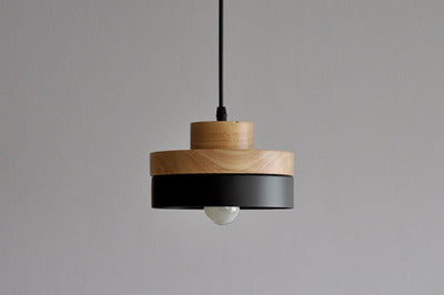 Huzhou Pendant Light — Round wooden pendant in matte black with white light.