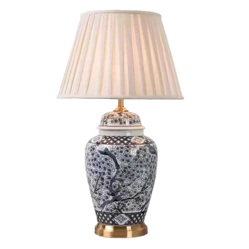 Bintang Ceramic Table Lamp — Blue-and-white ceramic lamp base with a pale fabric shade.